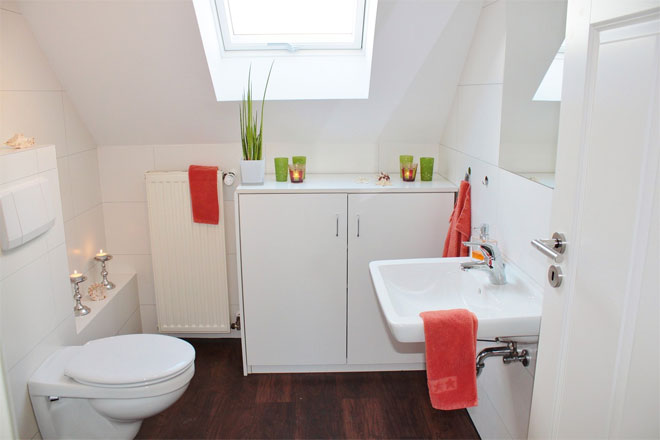 A Small White Attic Bathroom making the most of space