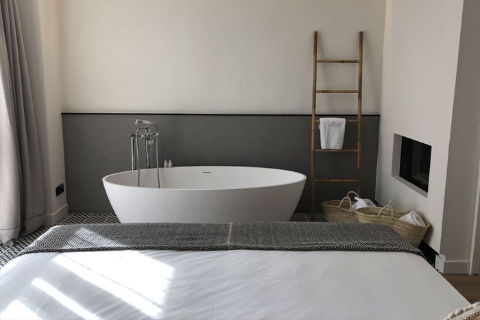 bedroom with freestanding bath