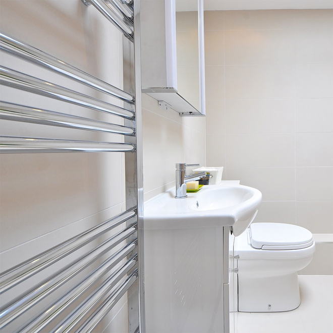 Heated Towel Rail in a white bathroom