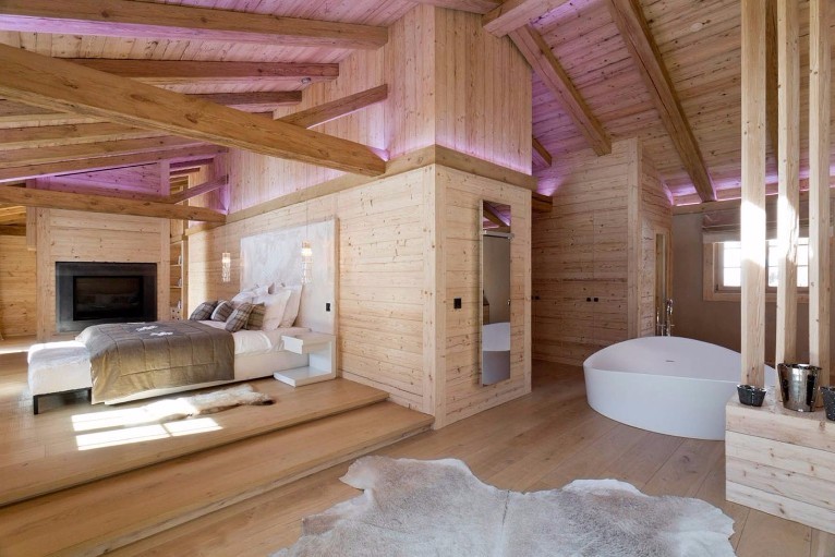 Gorgeous open plan loft space featuring wood and huge freestanding bath.