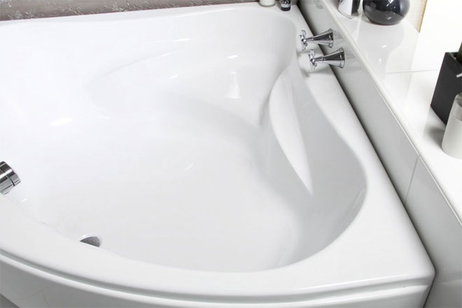 A white acrylic luxury corner bath