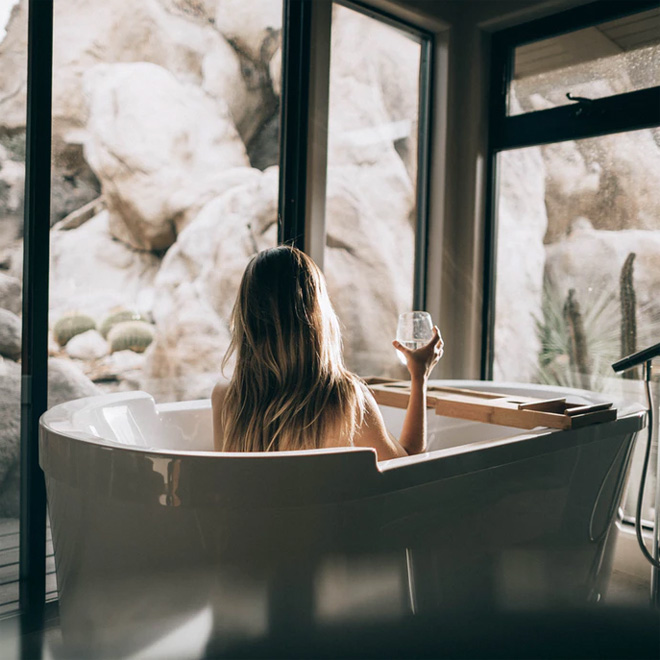 Girl drinking wine in a jacuzzi