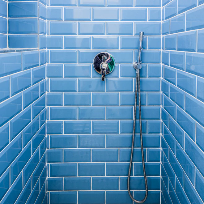 Blue bathroom tiles in a shower