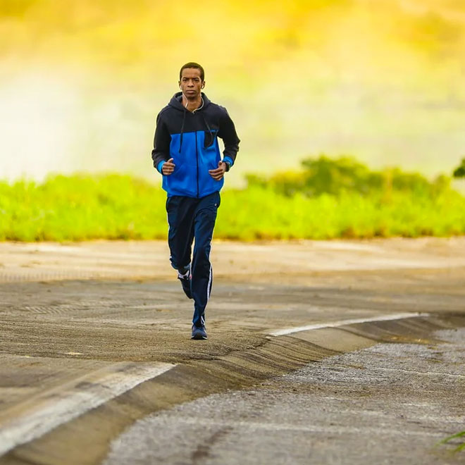 A man jogging on a road