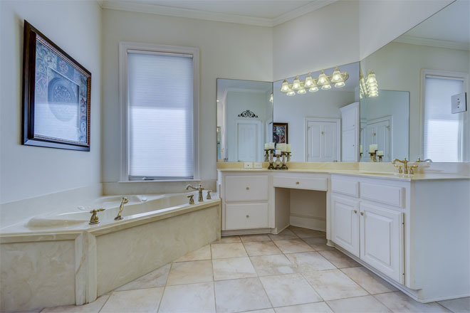 An oddly-shaped bathroom with a traditional feel.